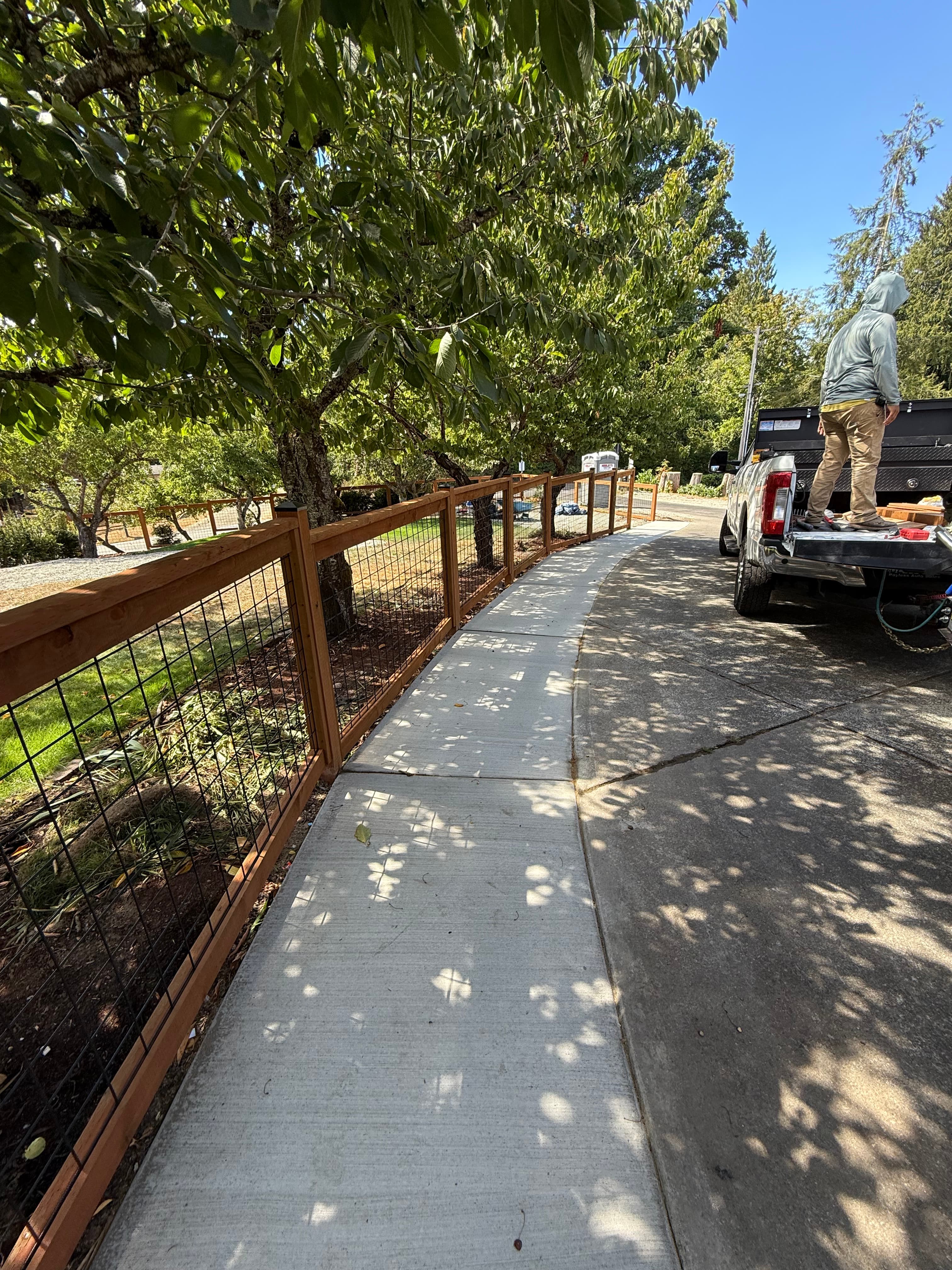 Fence installation detail with fresh site finish in Pierce County WA