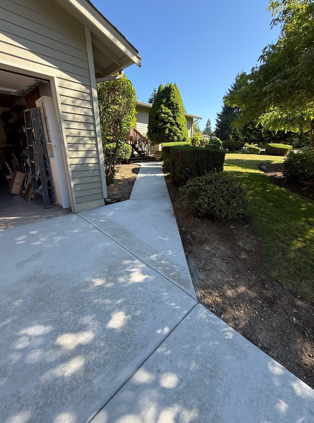 Completed concrete walkway and driveway transition in Tacoma WA